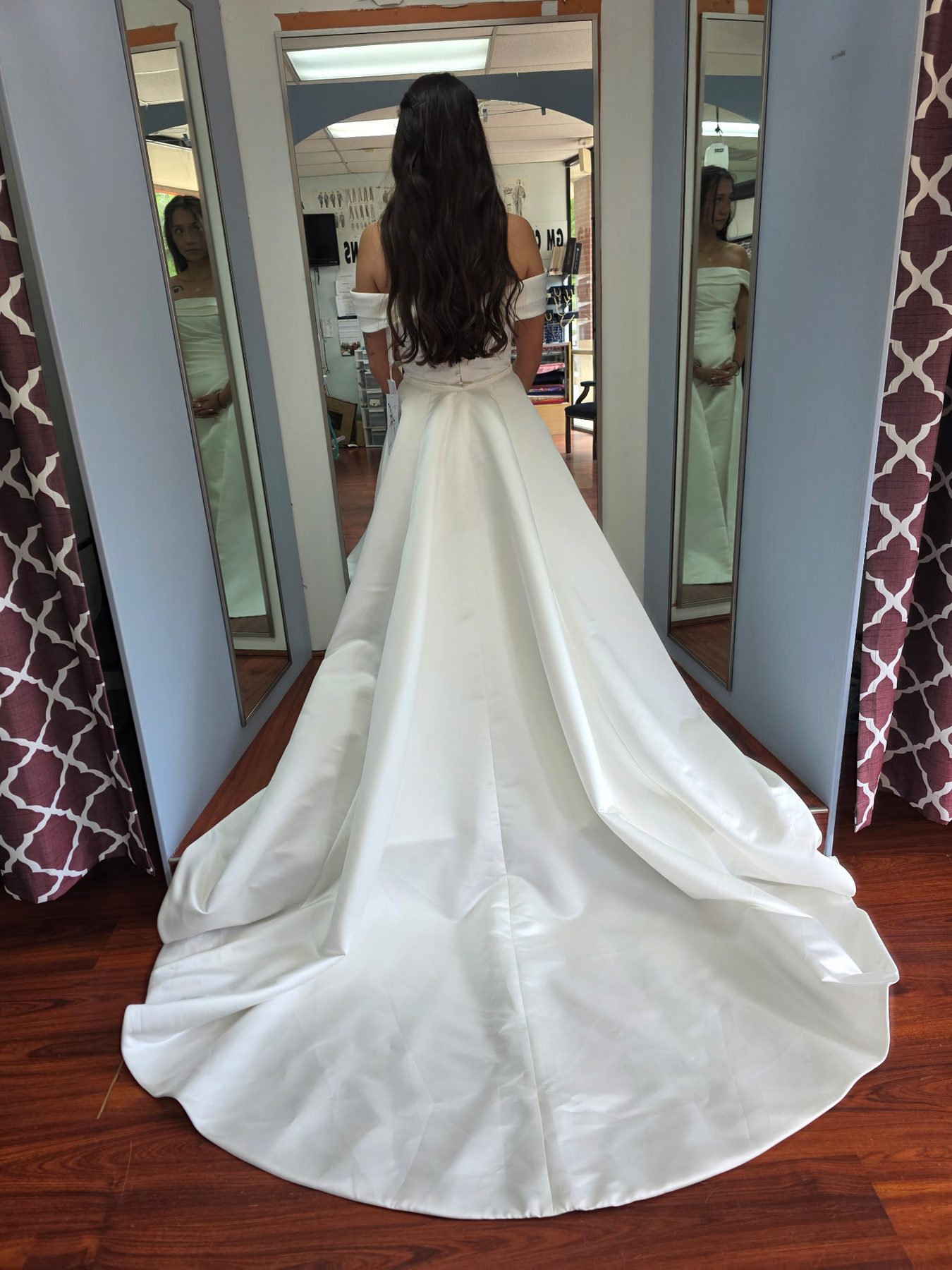 Bridal gown with a satin ball gown skirt and cathedral train, alterations in Sugar Land, TX