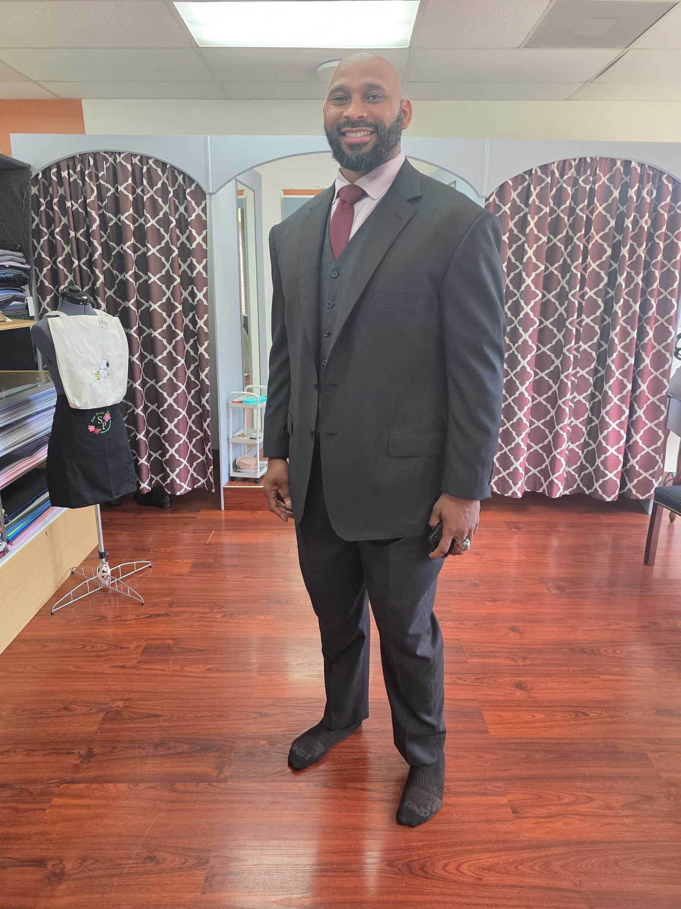 Custom made three-piece charcoal suit with a maroon tie, bespoke tailoring in Sugar Land, TX