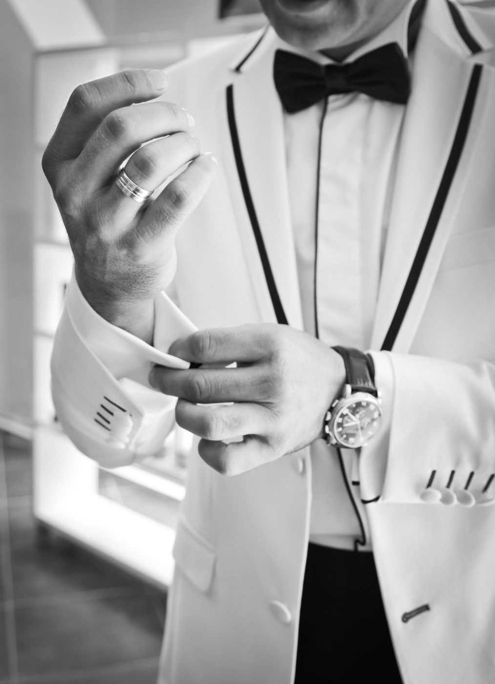 Bespoke charcoal tuxedo, cufflink detail with bow tie, custom tailoring for Houston clients