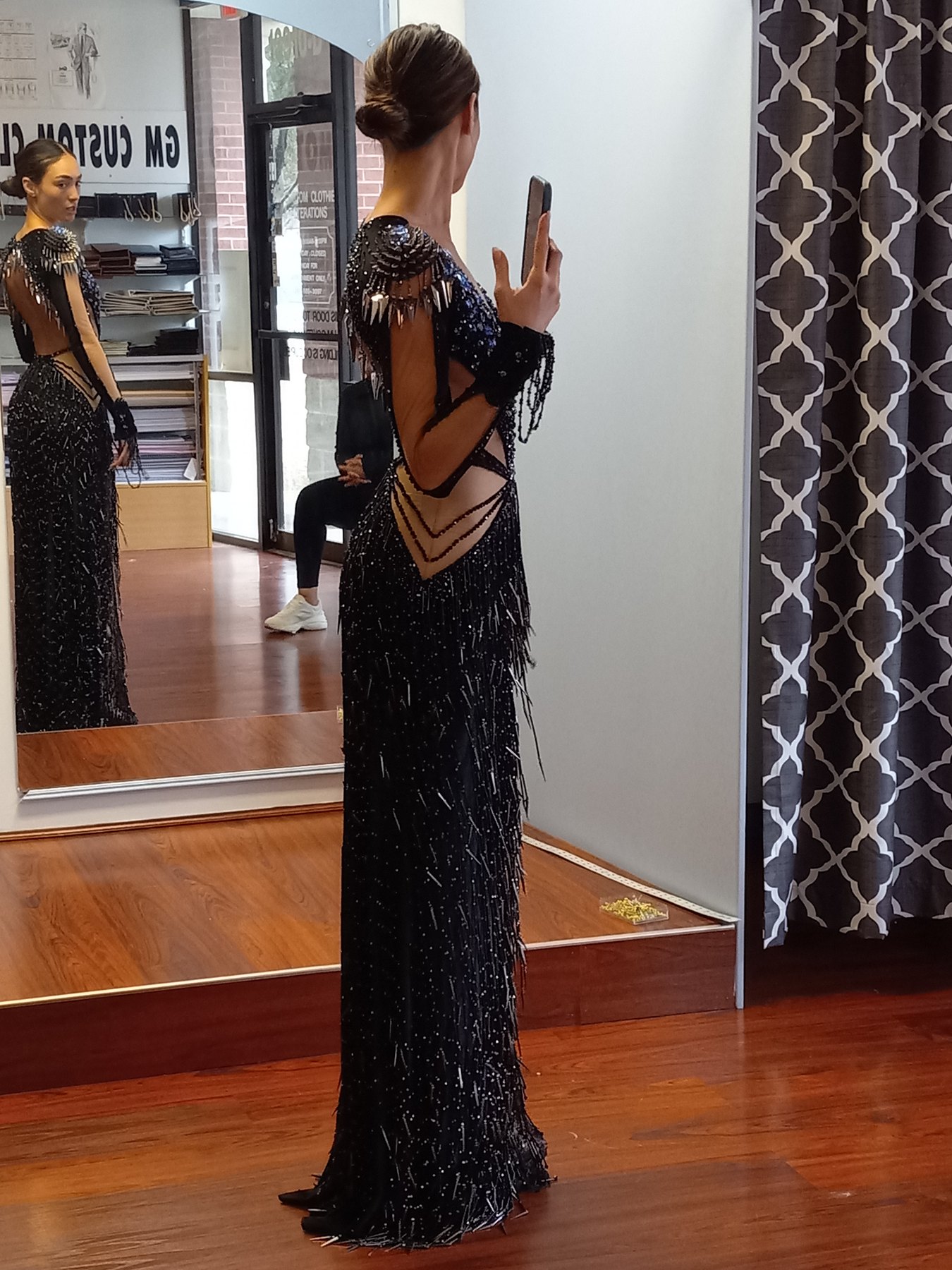 R'Bonney Gabriel at her fitting for the black beaded open-back gown, GM Custom Clothier, Sugar Land, TX