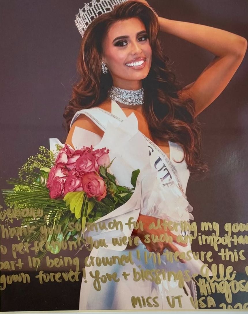 Photo of Miss Utah USA 2025 with a handwritten thank-you note to GM Custom Clothier for altering her gown